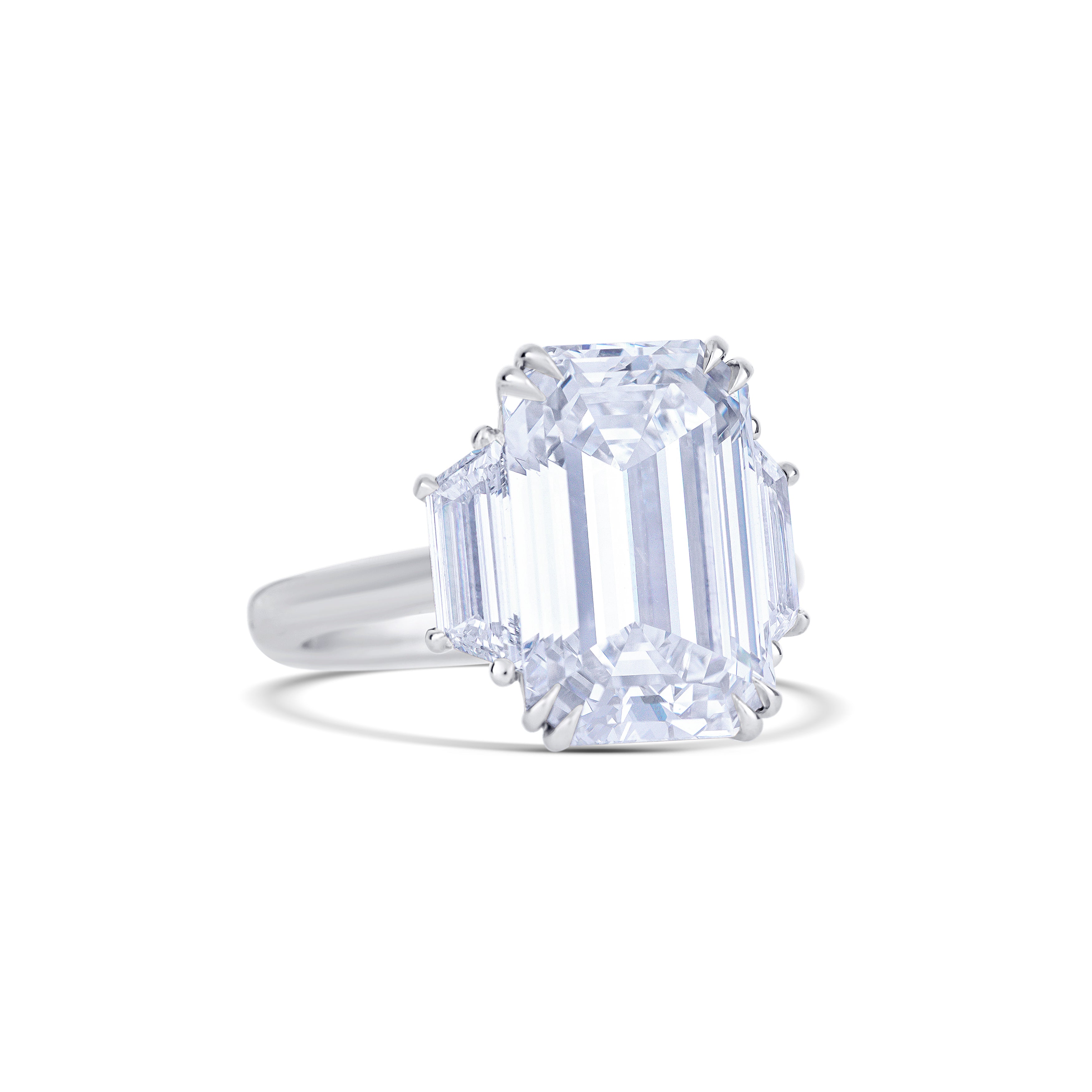 Platinum Emerald Cut Diamond Center Stone with Trapezoid Cut Side Stones Engagement Ring