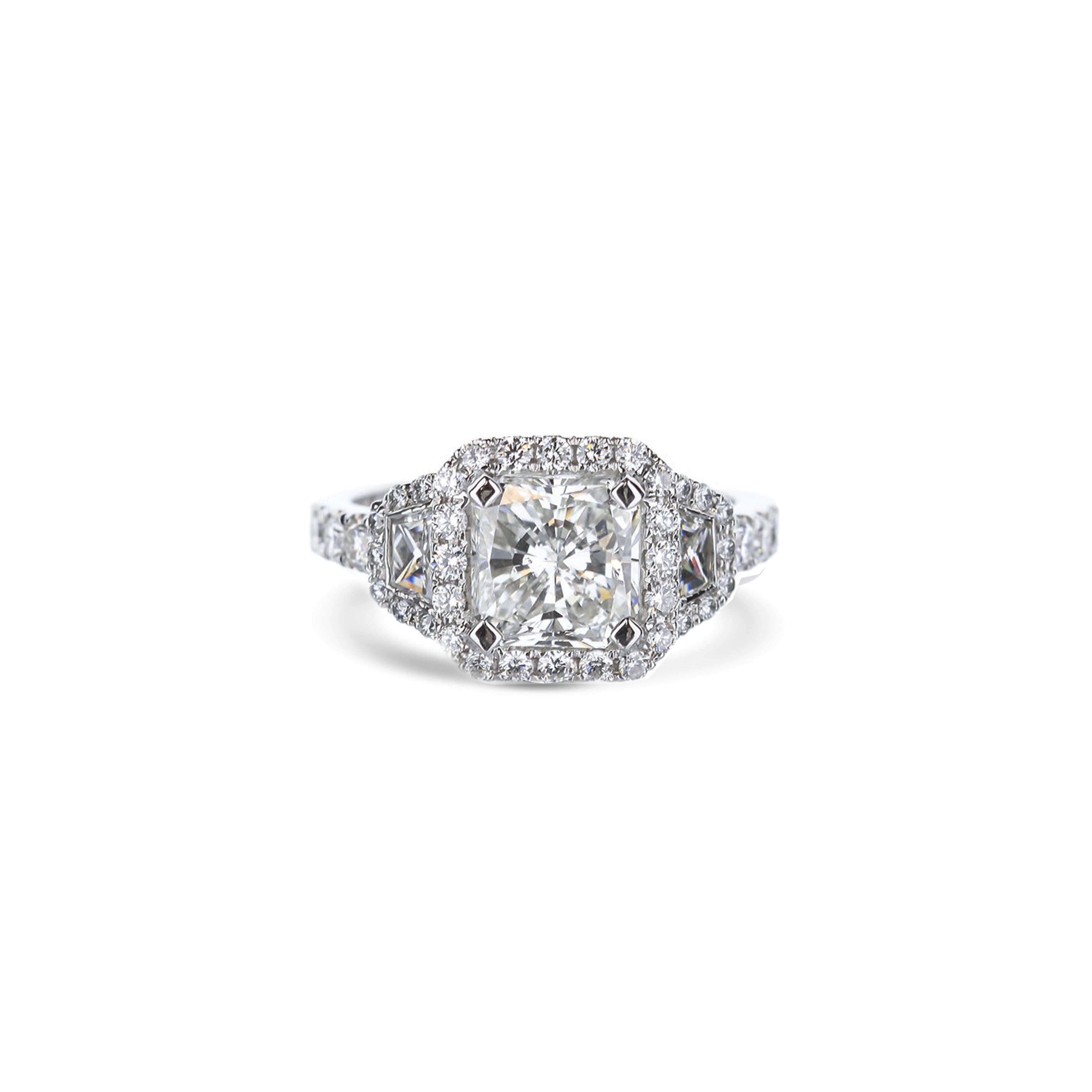 Platinum Princess Cut And Trapezoid Cut Diamond Halo Engagement Ring