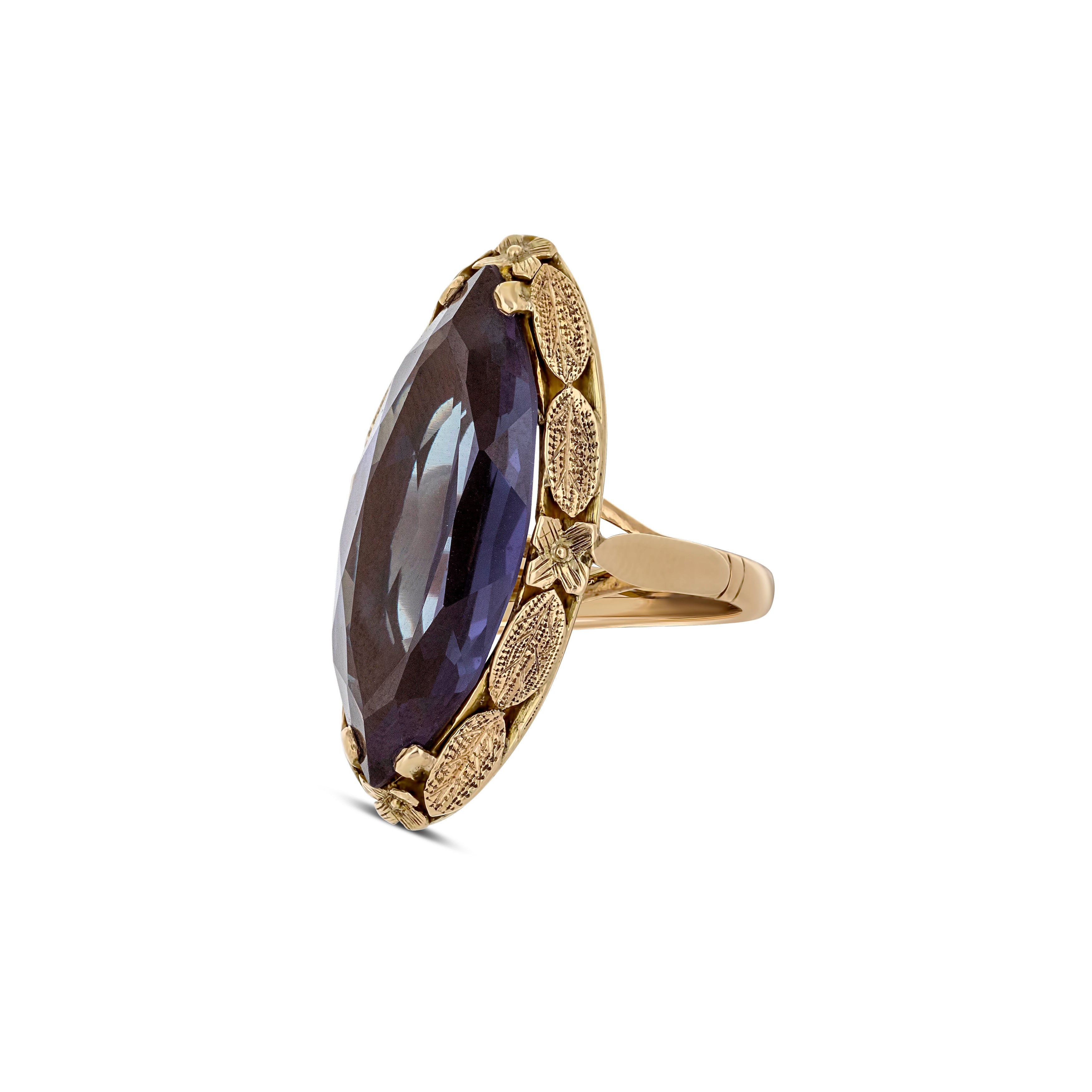 14k Gold Marquise Color Change Synthetic Sapphire with Leaf Detail around the Bezel Ring
