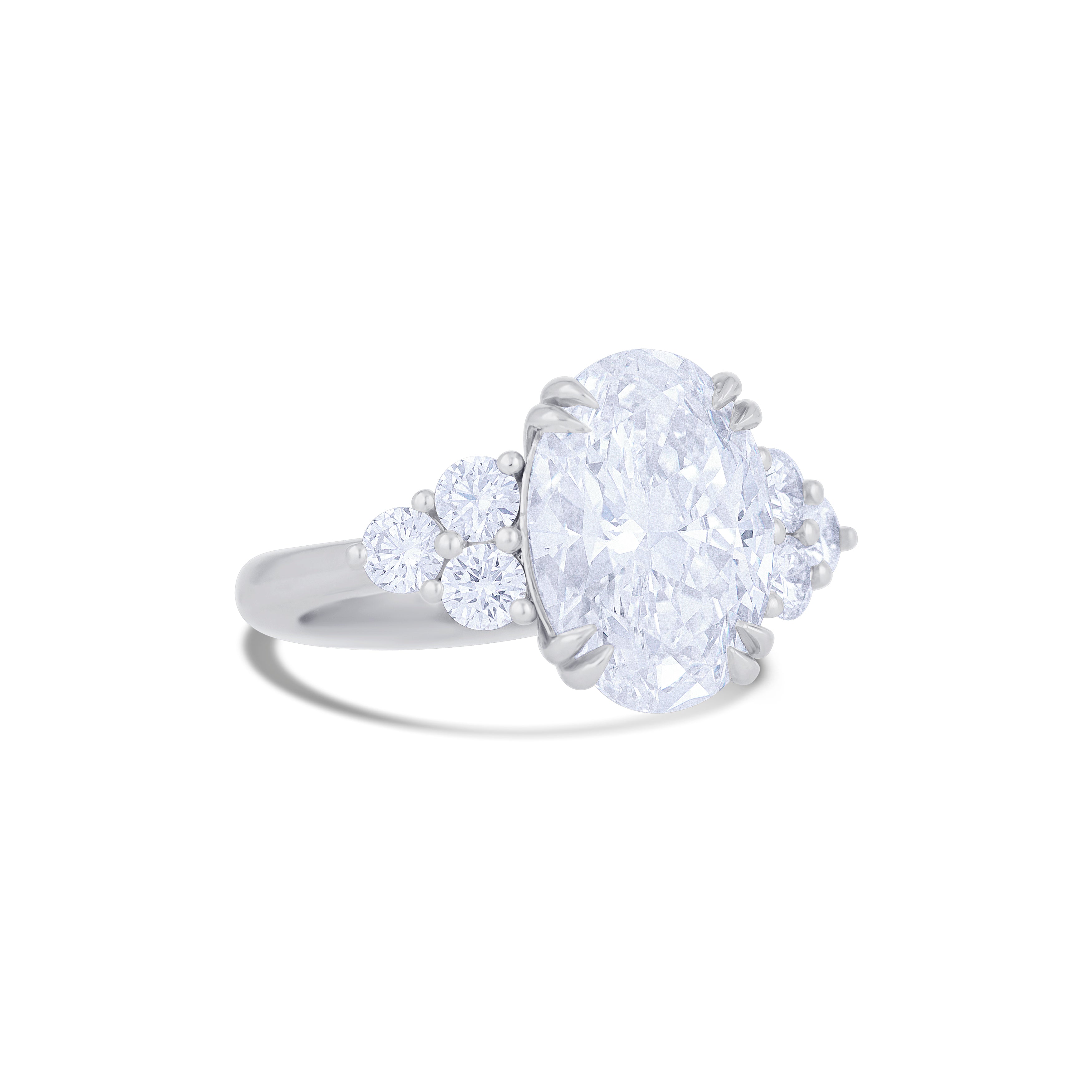 Platinum Oval Cut Diamond with Round Cut 3 Diamond Cluster Side Stones Engagement Ring