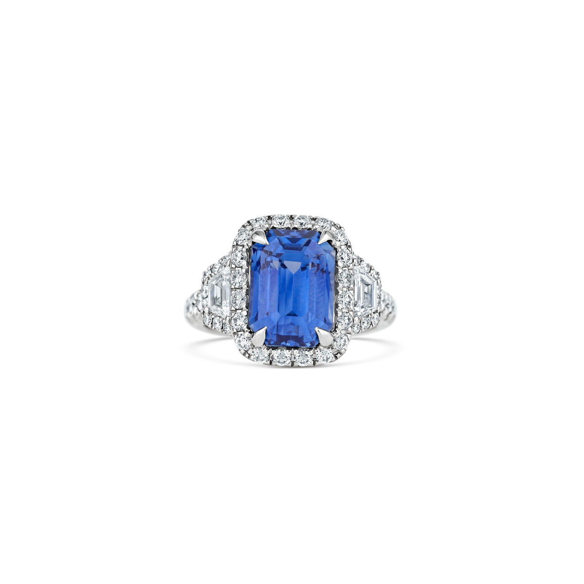 Platinum 8.69ct Emerald-Shape Sri Lanka Sapphire and Diamond Three Stone Halo Ring