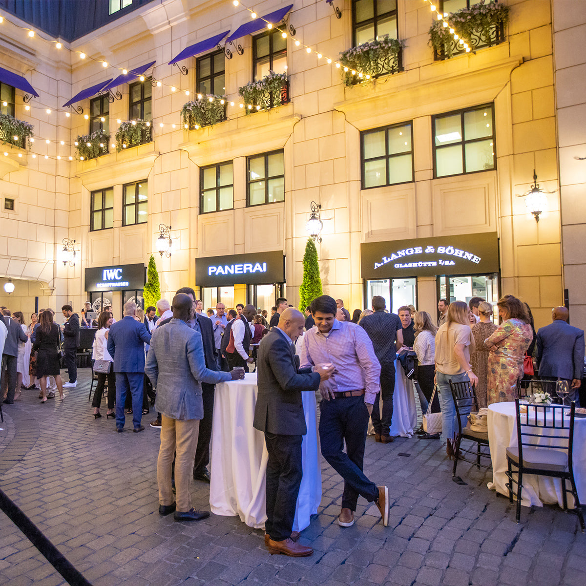 Grand Opening event held at the Waldorf Astoria Hotel featuring clients on the courtyard.