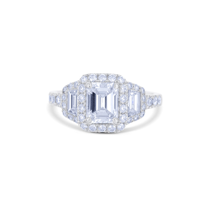 Platinum Triple Halo Ring With A 1.17 Carat Emerald Cut And Round Diamonds
