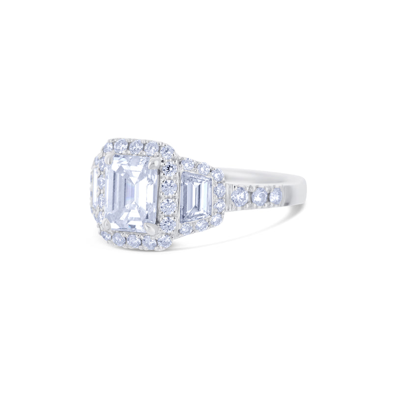 Platinum Triple Halo Ring With A 1.17 Carat Emerald Cut And Round Diamonds