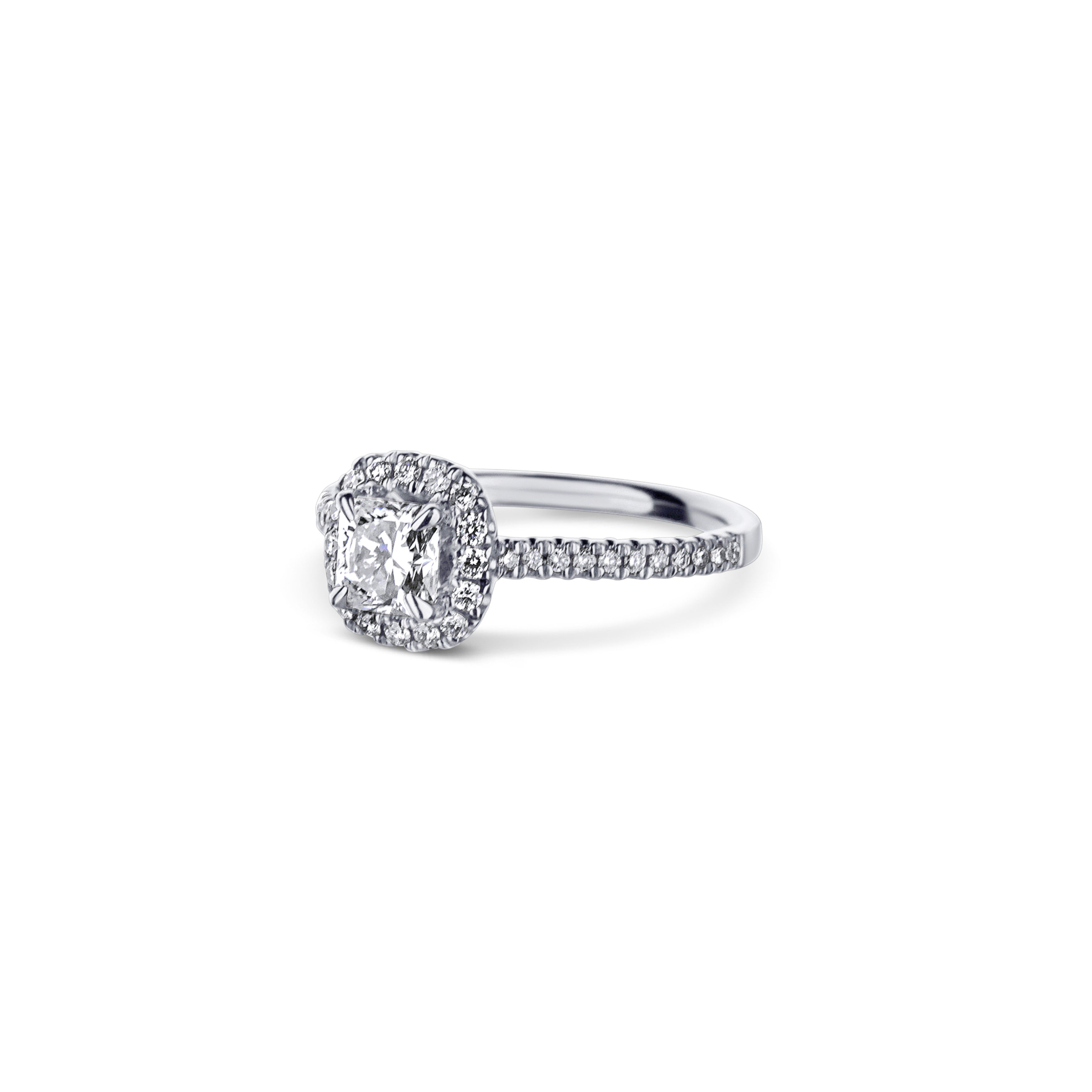 18K White Gold Engagement Ring With A 0.73 Carat Radiant Cut Diamond With Cushion Shaped Halo.