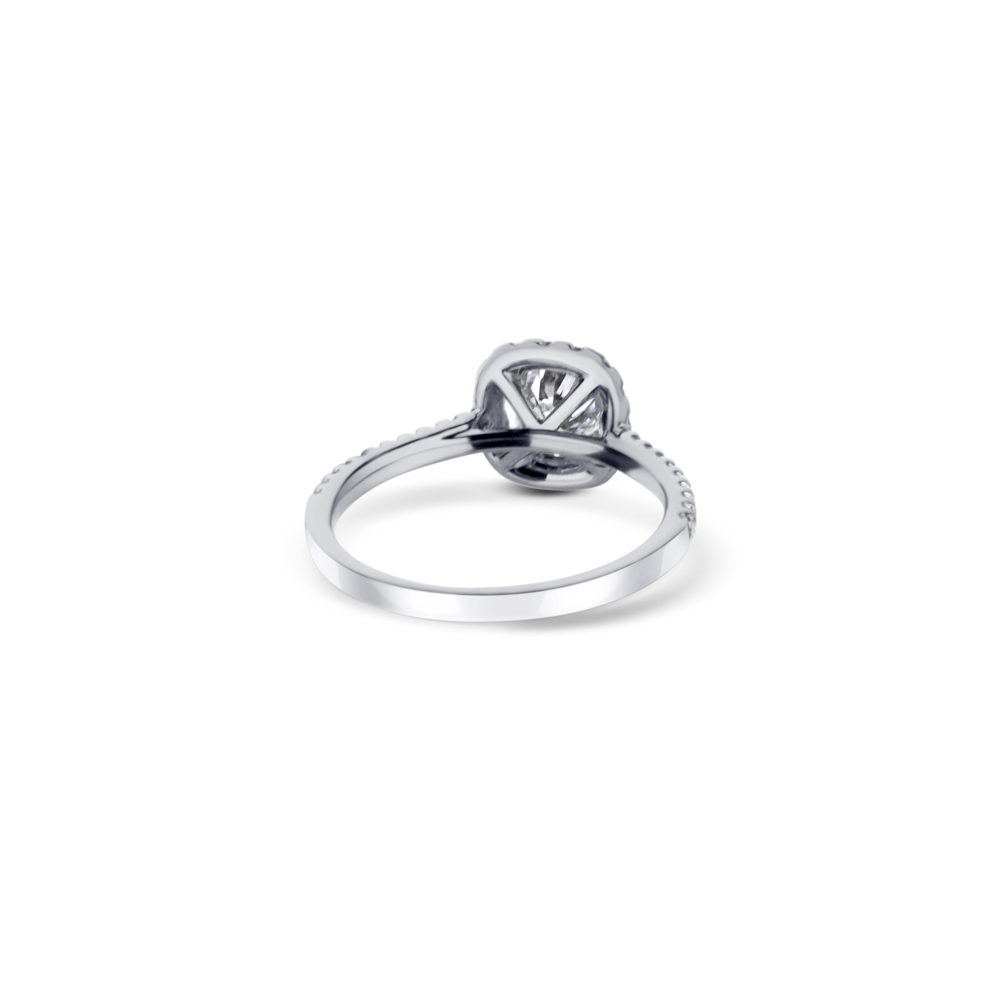 18K White Gold Engagement Ring With A 0.73 Carat Radiant Cut Diamond With Cushion Shaped Halo.