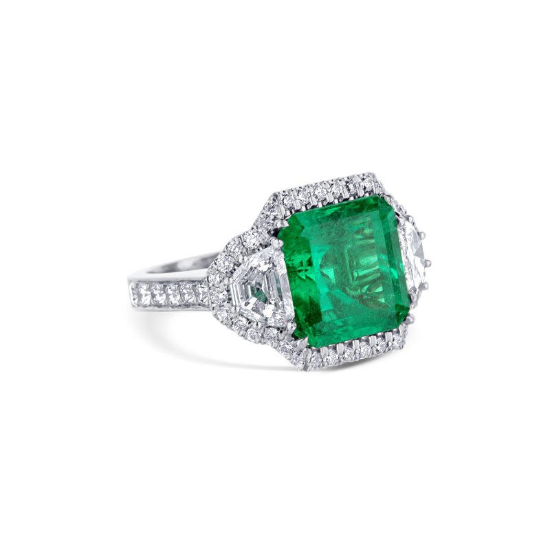 Platinum Emerald-Cut Emerald Engagement Ring With Hexagon-Cut Diamond Accents And Diamond Halo
